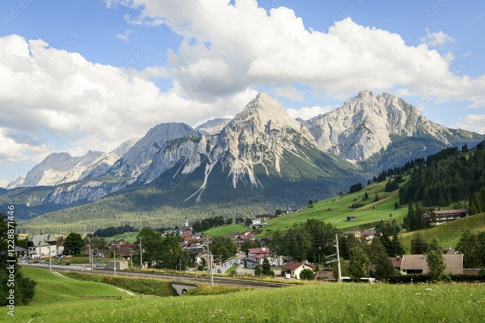 Fototapeta premium View of Leermoos and Ehrwald on the long-distance cycle path Via Claudia Augusta, in the background Ehrwalder Sonnenspitze, mountain landscape, Tyrolean Alps, Ehrwald basin, near Ehrwald, Lermoos, Tyrol, Austria, Europe