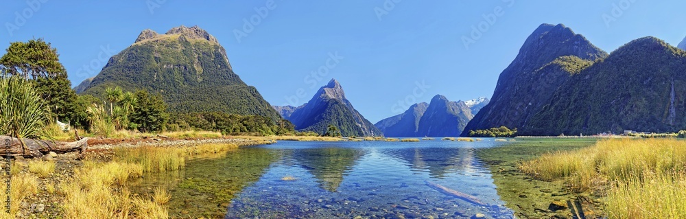 Panorama of Milford Sound, Mitre Peak reflected in water, Fiordland National Park, Te Anau, South Island, New Zealand, Oceania Panorama of Milford Sound, Mitre Peak reflected in water, Fiordland National Park, Te Anau, South Island, New Zealand, Oceania