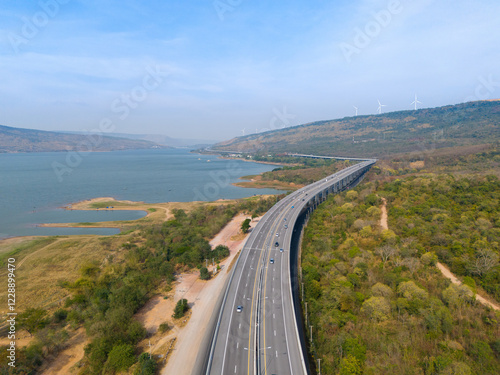 The M6  motorway Expressway Nakhon Ratchasima Province - Bang Pa-in. Lam Ta Khong River and Mountain. Drone shot of scenic landscape rural place traffic. Nakhon Ratchasima Thailand. Motorway Korat photo