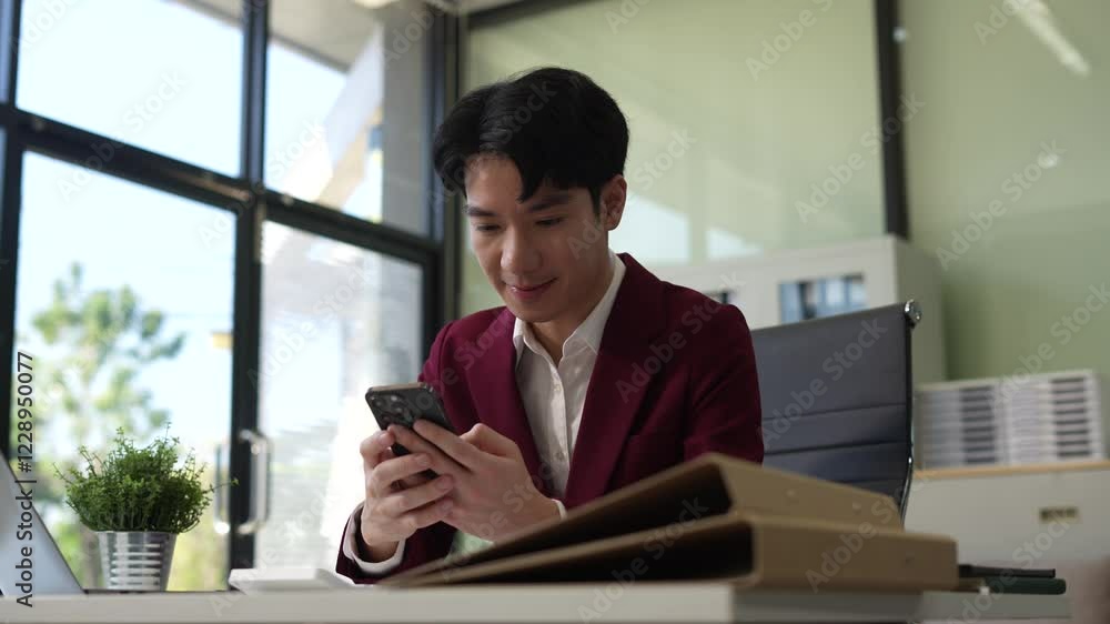 Businessman sitting at table using mobile phone, online working on laptop, searching the information on internet network. Businessman sitting at table using mobile phone, online working on laptop, searching the information on internet network.