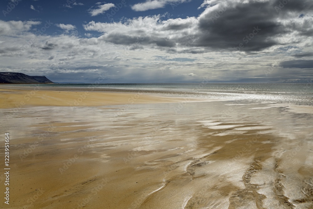 Brighter sandy beach with back light, dramatic clouds, Brekkuvellir, Westfjorde, Nordurland vestra, Iceland, Europe Brighter sandy beach with back light, dramatic clouds, Brekkuvellir, Westfjorde, Nordurland vestra, Iceland, Europe