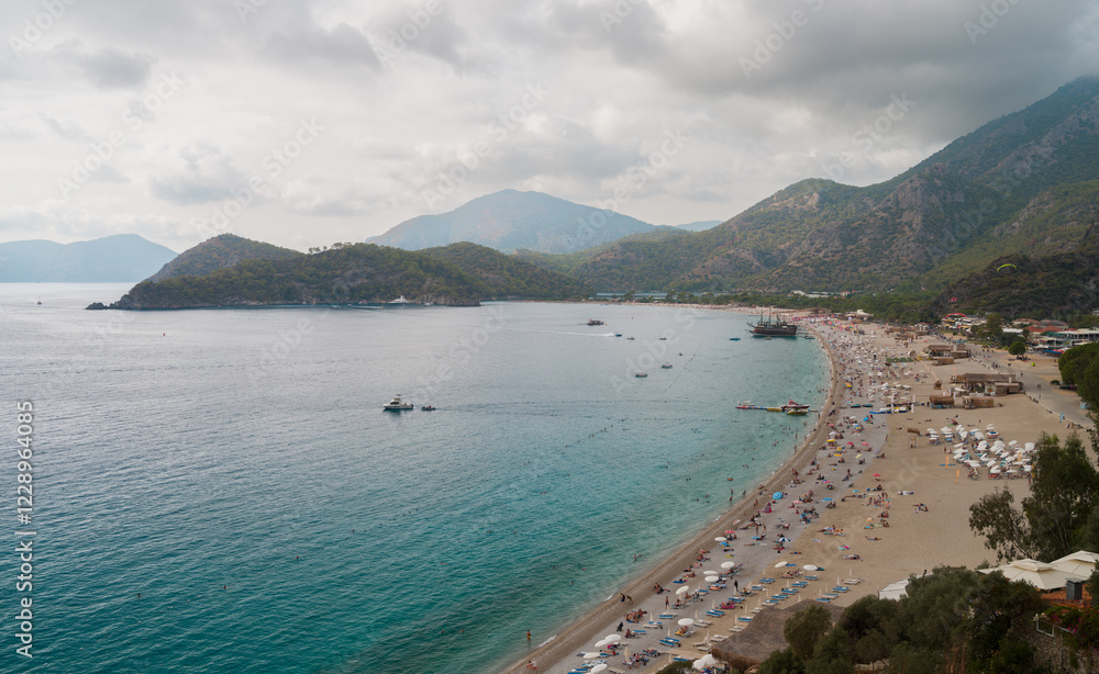 Fototapeta premium Oludeniz beach in the autumn season. Holiday on the Mediterranean coast of Turkey. Fethiye district, Mugla province, Turkey country 
