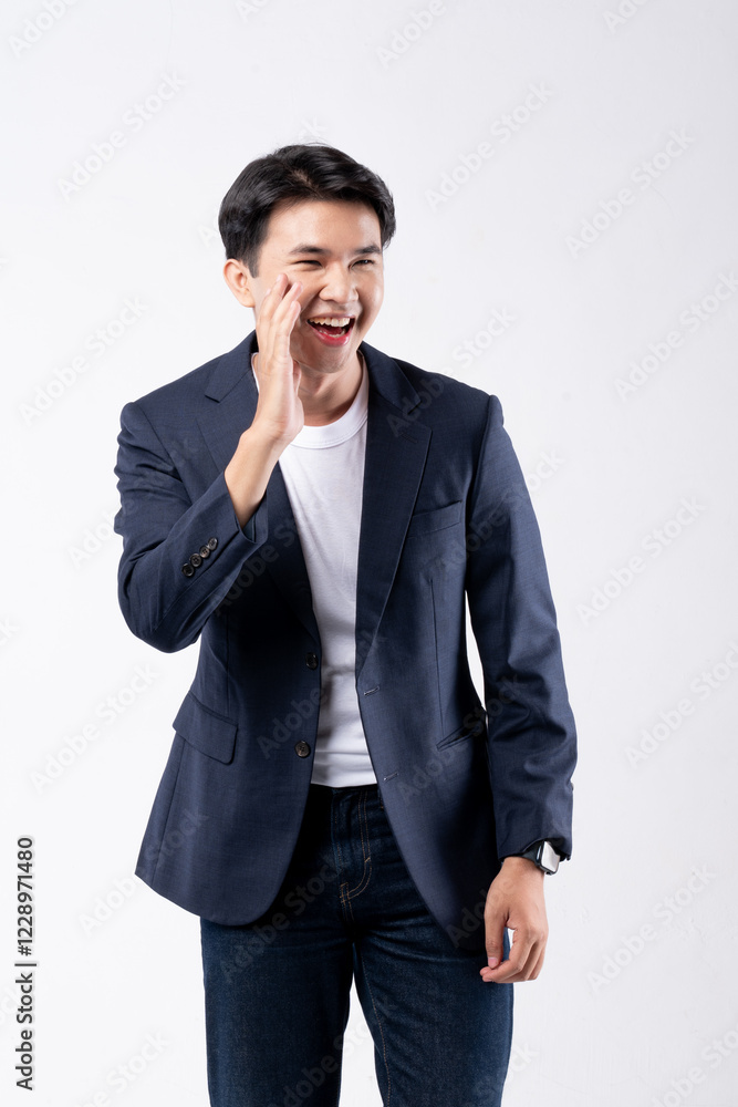 A man in a blue suit and white shirt poses for a photo