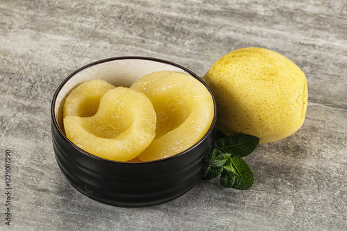 Canned yellow pear with syrup photo