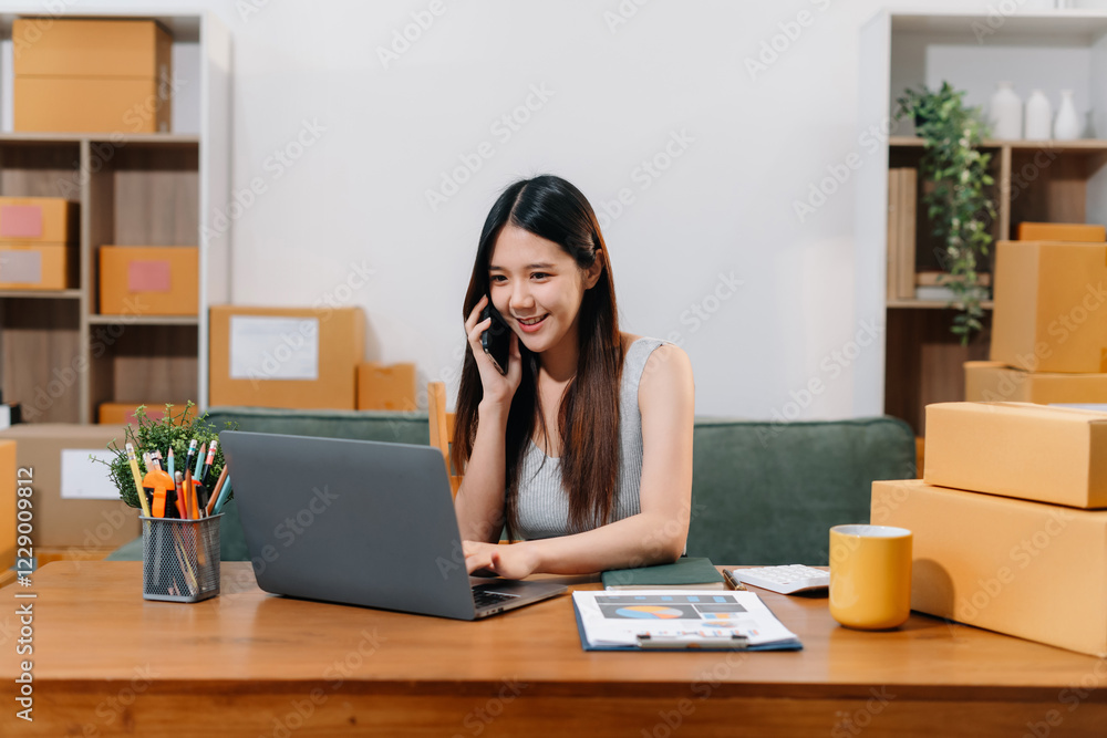 Woman start up small business owner at workplace. small business entrepreneur SME or freelance asian woman working with box at home Woman start up small business owner at workplace. small business entrepreneur SME or freelance asian woman working with box at home
