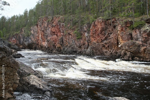 Red granite rocks in the rapids of the Oulankajoki river Oulanka in National Park, Lapland, Finland, Europe photo