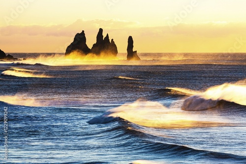 Reynisdrangar, stormy sea at sunrise, near Reynisfjara, Sudurland, South Iceland, Iceland, Europe photo