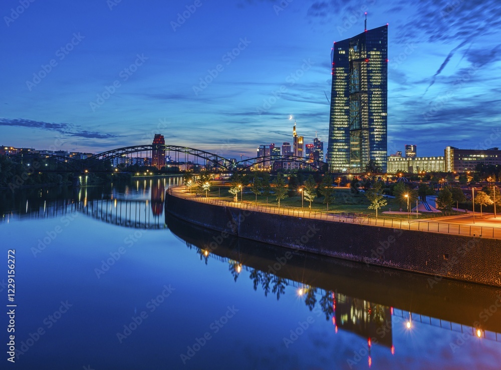 European Central Bank, ECB, at dusk in front of the illuminated skyline, roundabout at the Osthafen bridge, Frankfurt am Main, Hesse, Germany, Europe
