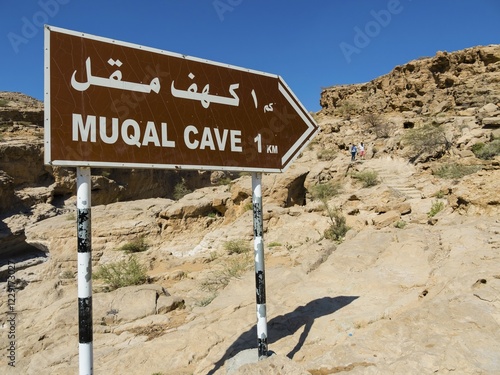 Sign pointing to Cave Muqal, near Wadi Bani Khalid, Sharqiya Region, Muqal, Oman, Asia photo