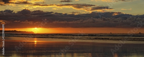 Fotografie Sunset at Carters Beach, sandy beach, water reflection, Westport, West Coast, So