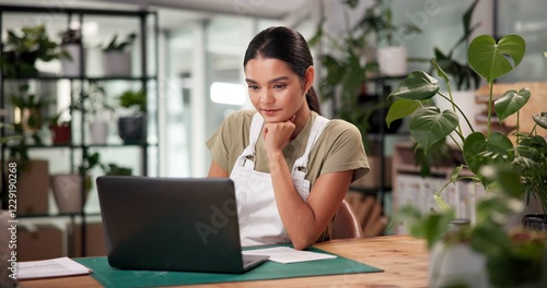 Laptop, online order and thinking with woman in flower shop for sale of floral arrangements. Computer, planning and plant nursery with florist at desk in office of small business to check inventory