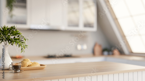 A minimalist hardwood kitchen tabletop adorned with decorative items, set in a sleek white kitchen.