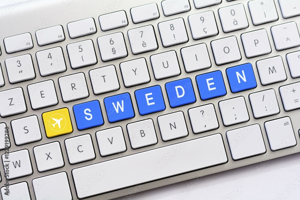 SWEDEN writing on white keyboard with a aircraft sketch SWEDEN writing on white keyboard with a aircraft sketch