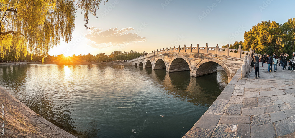 Obraz premium A modern bridge spanning calm water. The design of the bridge is very unique, showing a smooth curved shape, and the bridge body is illuminated by soft lights