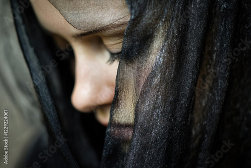 Close-up of a mourning veil on a grieving person’s face photo