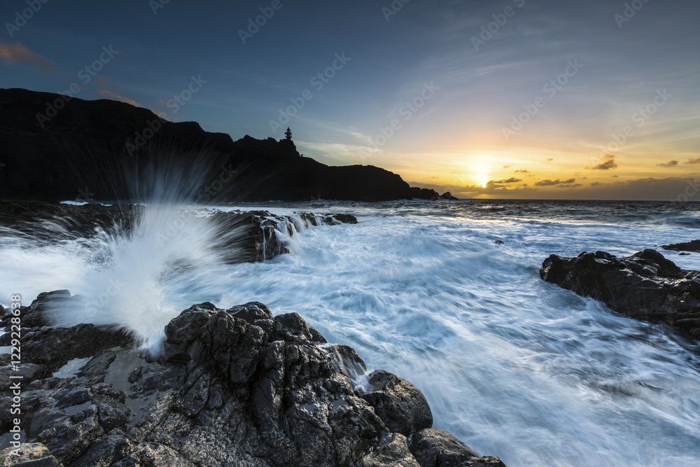 Obraz premium Surf, rocky coast with foaming waves at sunset, Faro de Teno, Buenovista, Tenerife, Canary Islands, Spain, Europe