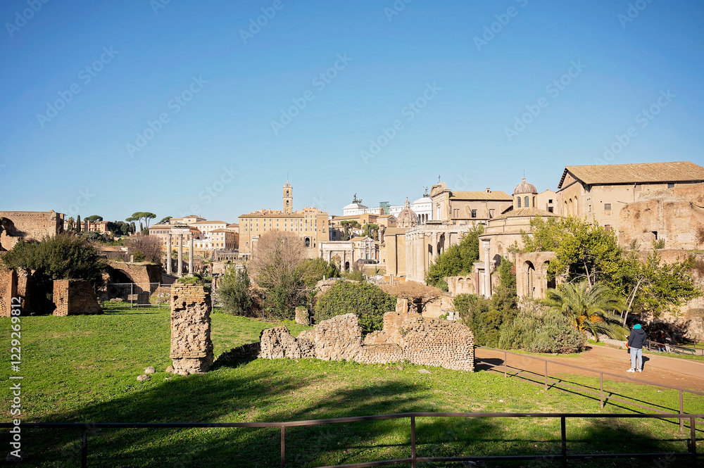 Ancient Roman ruins and cityscape under a clear blue sky Ancient Roman ruins and cityscape under a clear blue sky