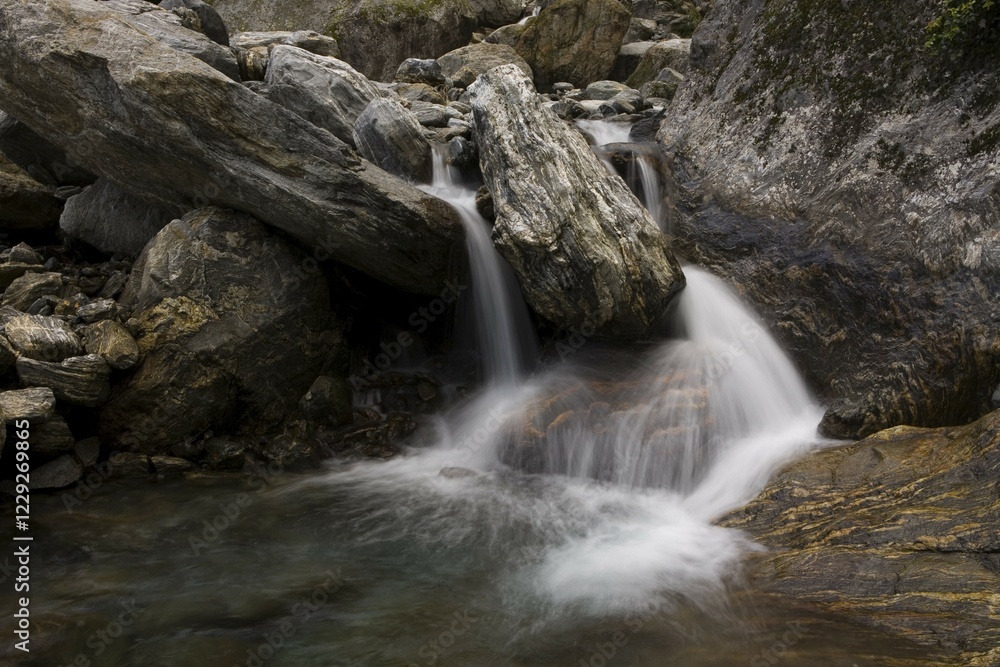 Naklejka premium Waterfall in the mountains, Copland Track, West Coast, South Island, New Zealand, Oceania