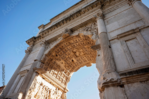 Low-angle view of a detailed ancient Roman triumphal arch
