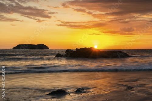 Sunset at Playa Espadilla, Manuel Antonio National Park, Costa Rica, Central America photo