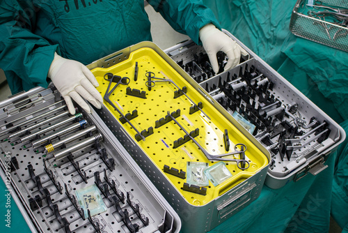 The instrument tray contain orthopedic surgery equipment . The tools was used in minimal invasive spinal surgery . Advance keyhole surgery in operating room. 