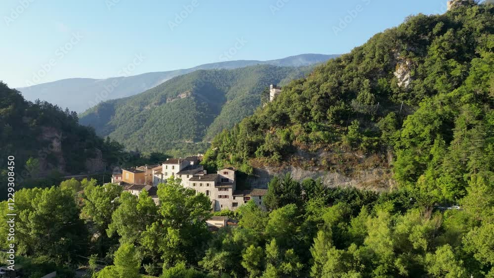 Upward drone shot moving over a serene village, showcasing the natural beauty of the south of France. Upward drone shot moving over a serene village, showcasing the natural beauty of the south of France.