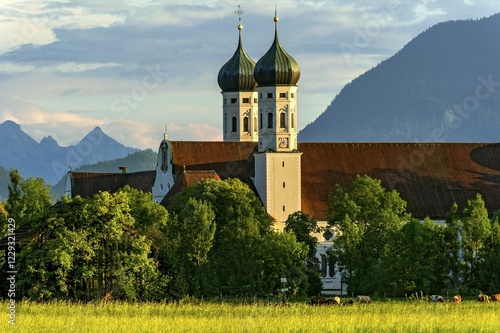 Basilica of St Benedict, Benedictine monastery Benediktbeuern, rear right Herzogstand of the Alps, in the back Arnspitze Group in Wetterstein range of  the Alps, Benediktbeuern, Upper Bavaria, Bavaria, Germany, Europe photo