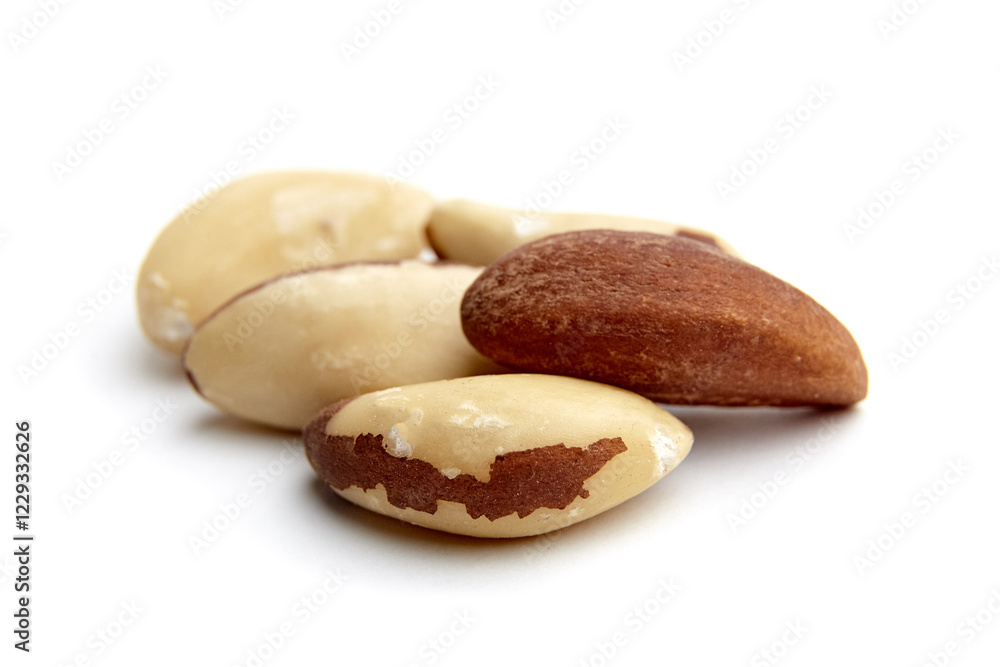 Close-up of Brazil nuts with natural brown and cream textures arranged on a clean white background, highlighting their smooth, nutritious appeal Close-up of Brazil nuts with natural brown and cream textures arranged on a clean white background, highlighting their smooth, nutritious appeal