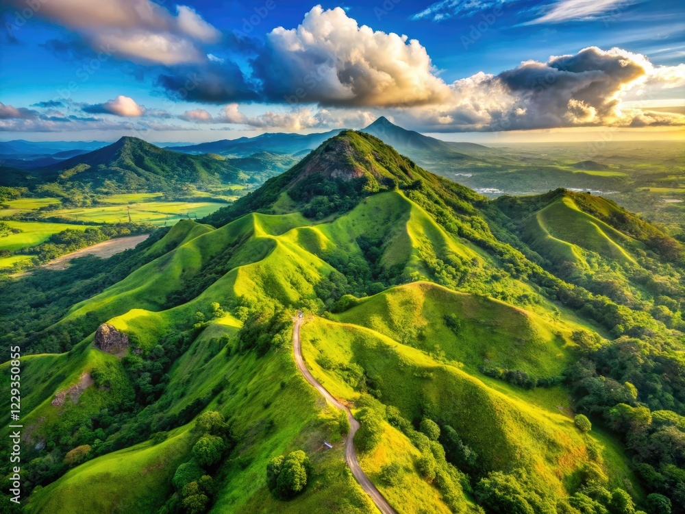 Naklejka premium Batulao Mountain's breathtaking volcanic landscape offers stunning drone photography opportunities, explored via challenging hiking trails.