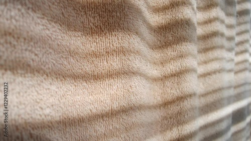 towel sways gently in the bar installation