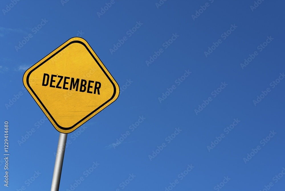 December, yellow sign with blü sky December, yellow sign with blü sky