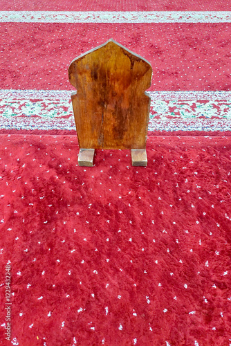 A wooden board to divide people praying in the mosque photo