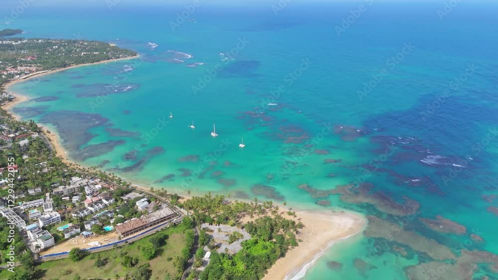 Aerial shot of Punta Popy Beach, Las Terrenas, showcasing the stunning view of the coastline, crystal-clear sea, and the tropical landscape in all its glory Aerial shot of Punta Popy Beach, Las Terrenas, showcasing the stunning view of the coastline, crystal-clear sea, and the tropical landscape in all its glory