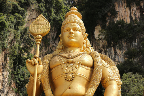 Canvas Print Portrait of a huge golden statue of Kartikeya or Murugan near the Batu Caves in Kuala Lumpur, Malaysia