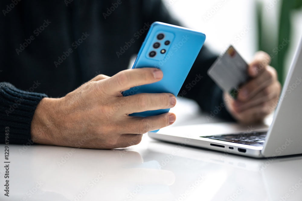 Man using credit card and paying via mobile banking app. Internet payment, online shopping, concept. Man using credit card and paying via mobile banking app. Internet payment, online shopping, concept.
