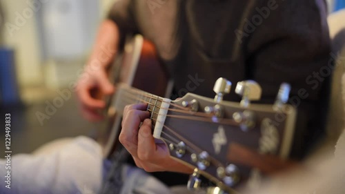 Playing guitar as a hobby cinematic shot