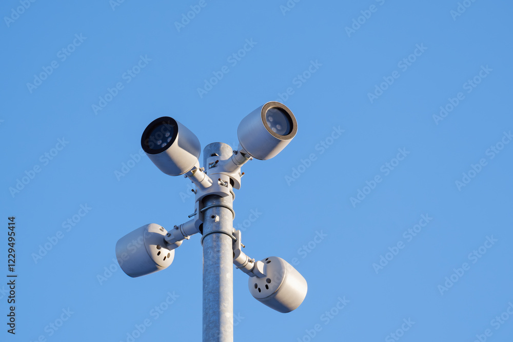 LED lights modern contemorary street lamp directed in different directions against blue sky background LED lights modern contemorary street lamp directed in different directions against blue sky background