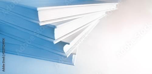Shallow and soft focus against macro view of stack of books. Copy space. Useful banner design