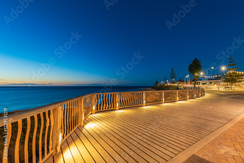 Christies Beach esplanade with Witton Bluff trail illuminated at night time while viewed towards the ocean