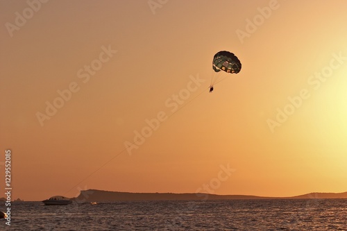 Parasail in sunset in San Antonio Abad - Ibiza photo