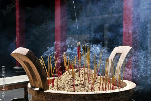 Smoking Incense in Chua Thien Hau Pagoda, Ho Chi Minh City, Saigon, Vietnam, Southeast Asia, Asia photo