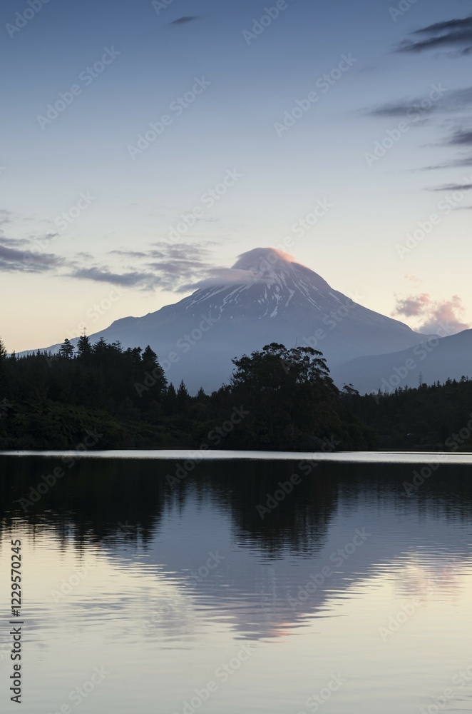 Fototapeta premium Currently inactive volcano, Mt. Egmont, Mt. Taranaki, reflection in the reservoir of Lake Mangamahoe, North Island, New Zealand, Oceania