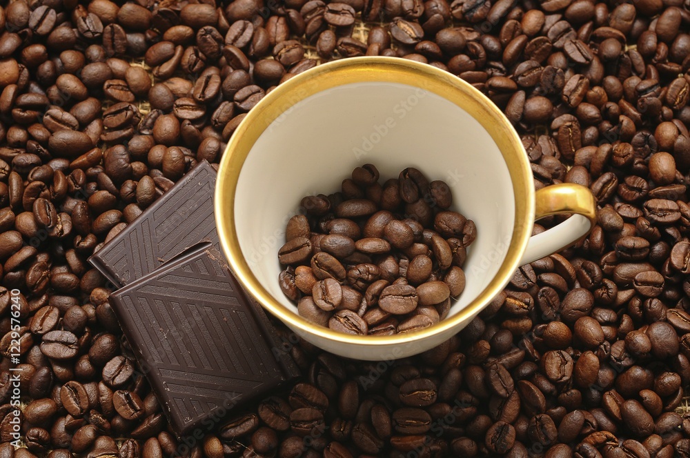 Coffee cup and chocolate on coffee beans Coffee cup and chocolate on coffee beans