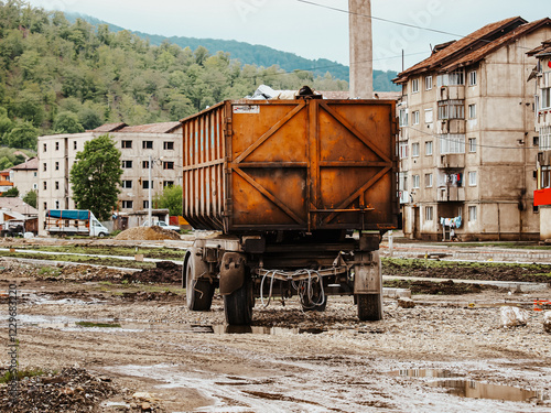 Old Residential Buildings And Urban Decay In Zlatna, Romania: A Typical East European Neighborhood With Construction Work, Trash Bins, And Dilapidated Infrastructure photo