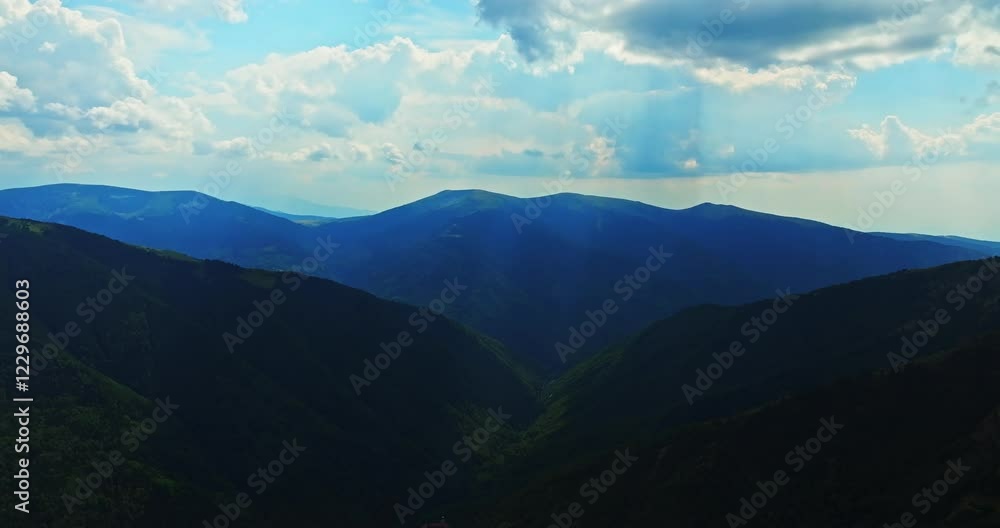 Vast Rila Mountain Valley With Sun Rays Shining From Above Cloudy Day In Rural Bulgaria Aerial High Altitude Orbit Scene Vast Rila Mountain Valley With Sun Rays Shining From Above Cloudy Day In Rural Bulgaria Aerial High Altitude Orbit Scene