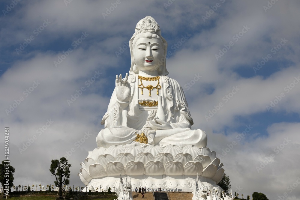 Fototapeta premium Giant Guan Yin statue at Wat Huay Pla Kang Temple, sitting Buddha on lotus flower, Chiang Rai, Northern Thailand, Thailand, Asia