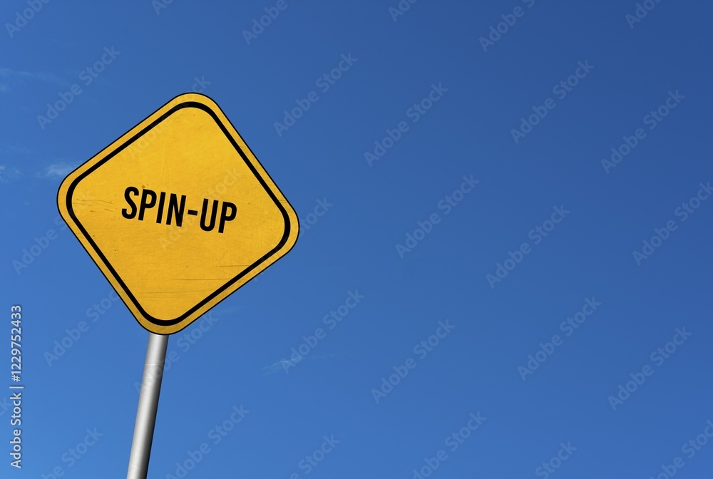 Spin-up, yellow sign with blue sky Spin-up, yellow sign with blue sky