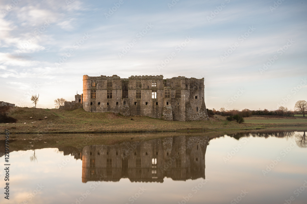 Carew Castle at sunrise, with reflections Carew Castle at sunrise, with reflections
