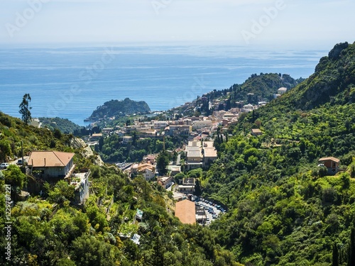 Townscape with Naxos Bay, Taormina, Sicily, Italy, Europe photo