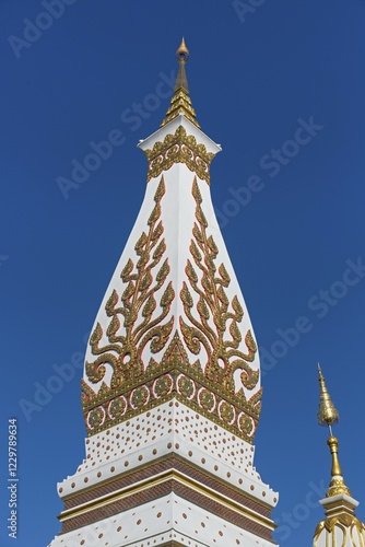 Lace of Chedi Wat Phra That Phanom decorated with golden ornaments, temple complex in Amphoe That Phanom, Nakhon Phanom Province, Isan, Thailand, Asia photo